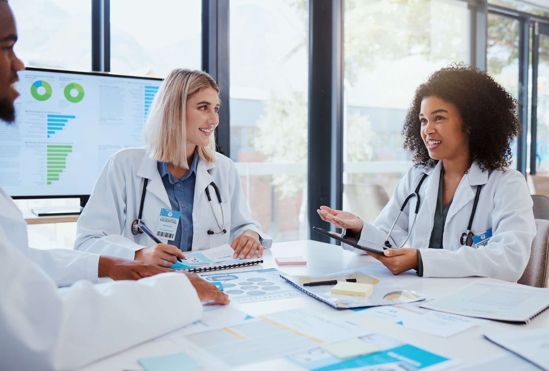 Healthcare, meeting and teamwork with a doctor and her team planning for growth, research and innovation in the medical industry. Collaboration, medicine and communication with a woman surgeon